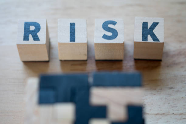 istock Risk assessment, decision to accept business result in uncertainty, unpredictable situation concept, cube wooden block with alphabet building the word RISK. 1134036823