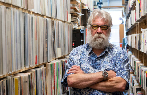 istock Record collector in front of his collection 1134036880