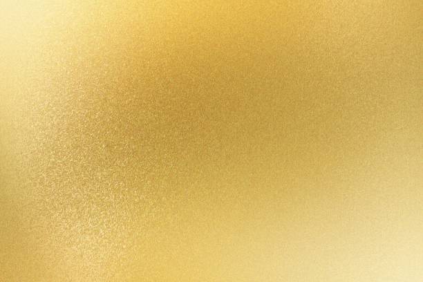 シャイニーライトゴールドメタリックシート、抽象的な質感の背景 - flakes ストックフォトと画像