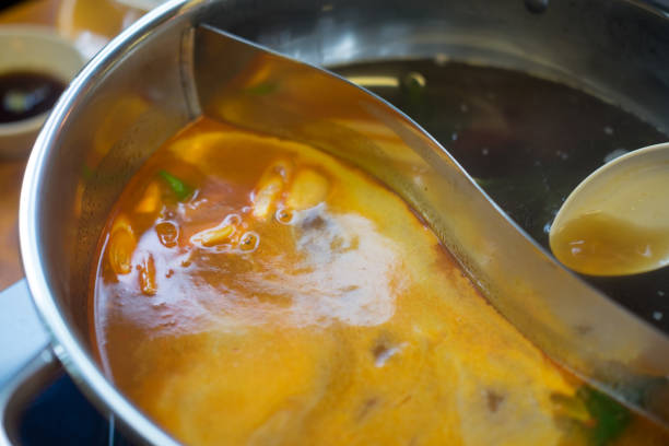 istock Double flavor hot pot in hot pot buffet (black and spicy tom yum soup) 1134036927