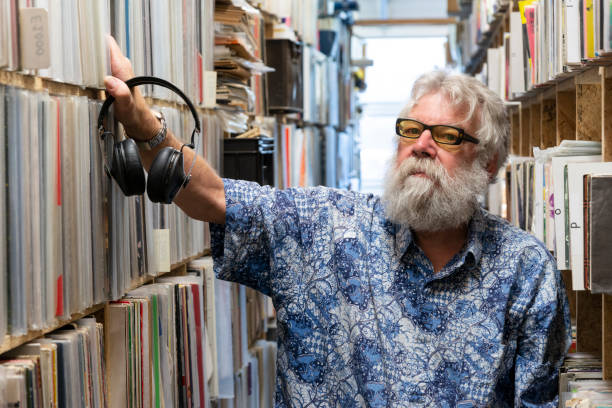 istock Record collector in front of his collection 1134037114