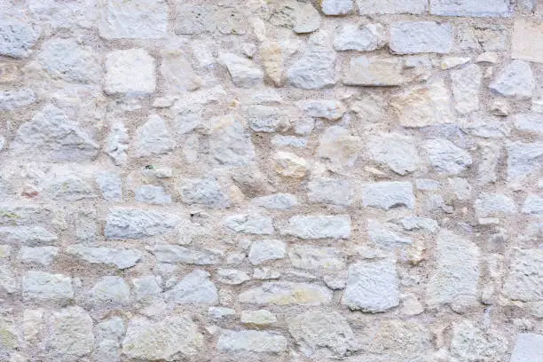 An old stone wall with beautiful structure as a background