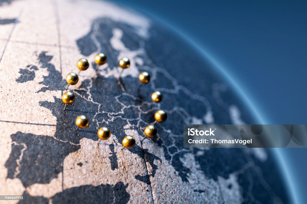 European Union - Golden pins on cork board globe Abstract European Union flag European Union Stock Photo