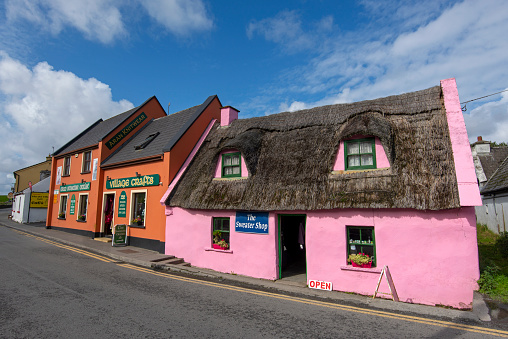 Street with colorful shops, pubs and cottages in the village of Doolin, Ireland. From Doolin one can catch a ferry to one of the Aran Islands.
