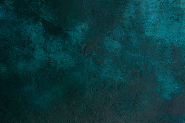 istock texture old stone concrete wall dark green color with cracks , background 1134040846