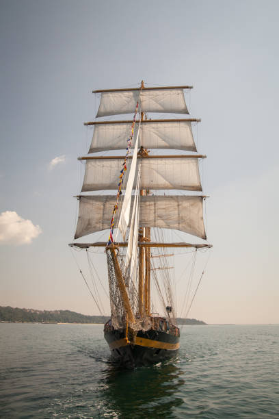 istock old historical ship (yacht) with white sails, sailing in the sea 1134041598