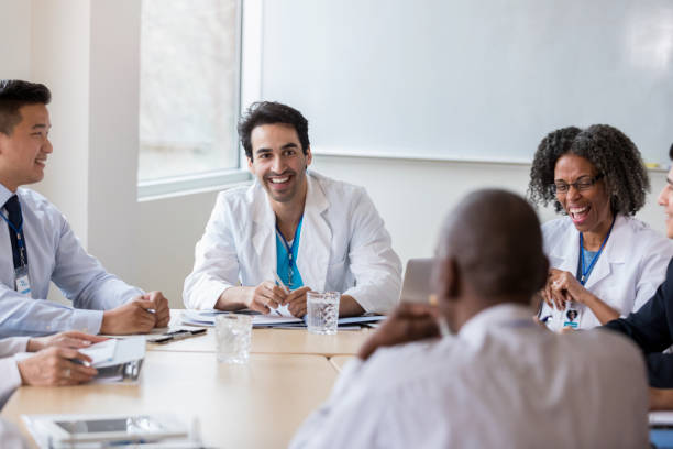 istock Medical professionals laugh together during meeting 1134043558