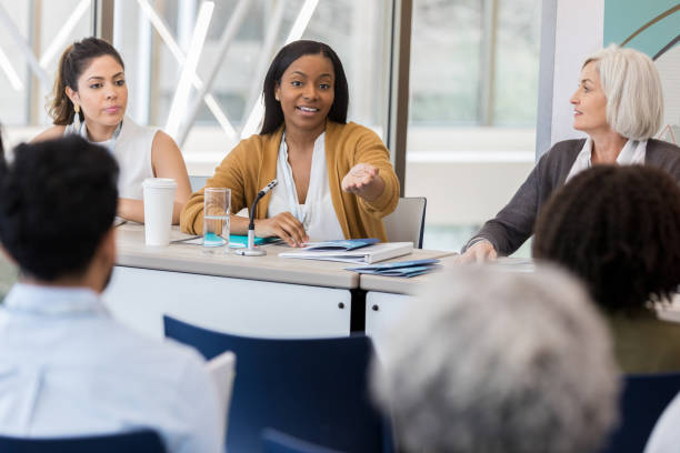 istock Confident woman on women's panel answers question 1134043616