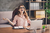 Close up photo beautiful she her business lady hand arm head raised up laugh laughter big salary income earnings genius startup notebook table sit office chair wearing specs formal-wear shirt