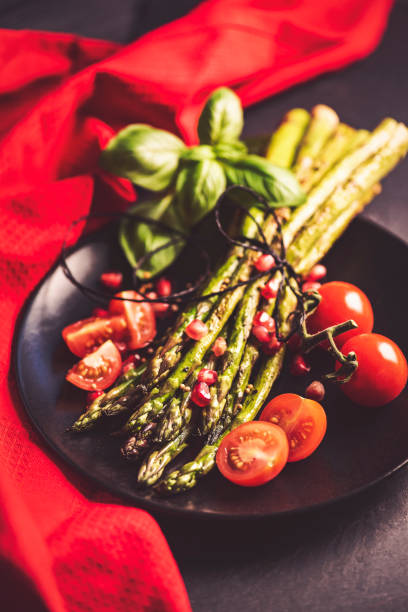 istock Grilled Asparagus with Pomegranate Seeds and Tomatoes 1134044840