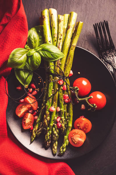istock Grilled Asparagus with Pomegranate Seeds and Tomatoes 1134044915