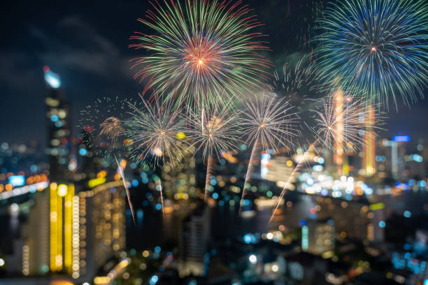 istock Fantastic Multicolor Firework Celebration over the Abstract Photo blurred bokeh of bangkok cityscape river view at twilight time, happy new year and celebration concept 1134044998