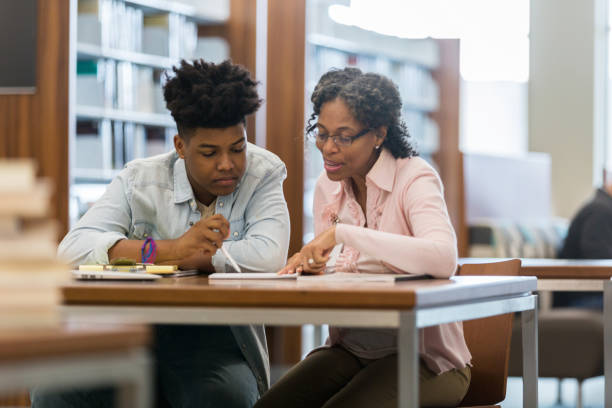 istock High school mentor helps teenage boy with homework 1134045015
