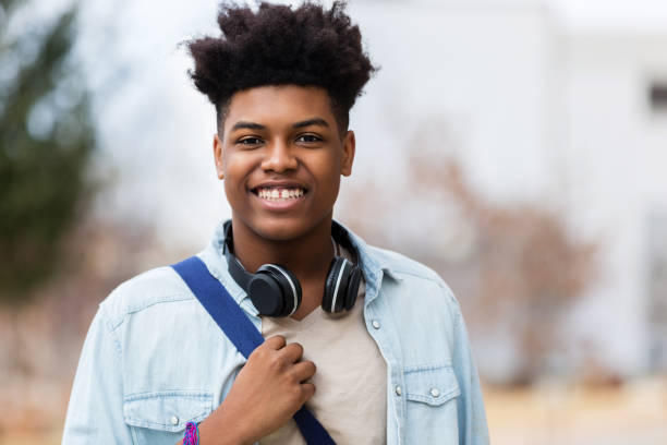 istock Cheerful male high school student smiles for camera 1134045043