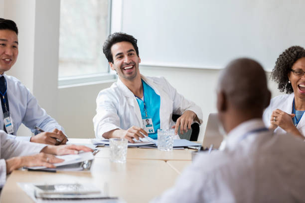 istock Cheerful doctor during staff meeting 1134045125