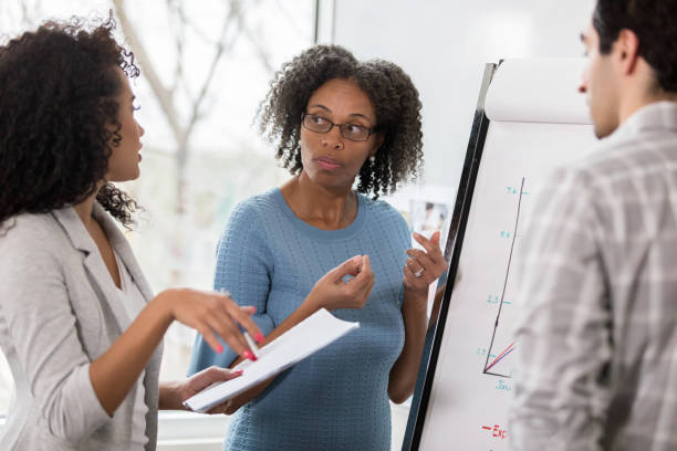 istock Attentive businesswoman meets withe colleagues 1134045195