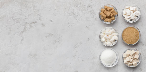 istock Collection of different kinds of sugar on gray background 1134045352