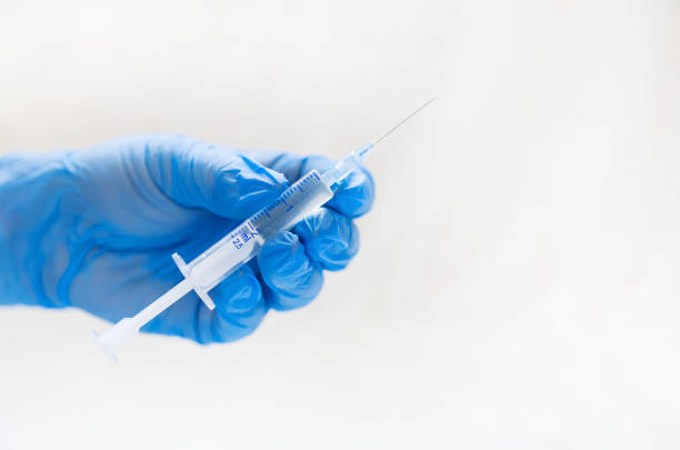 istock an injection in the hands of the nurse. selective focus. 1134045475