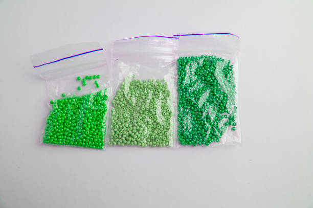 istock Set of multi-colored beads and beads in a mini plastic bag for embroidery needlework 1134046309