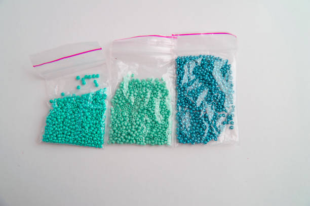 istock Set of multi-colored beads and beads in a mini plastic bag for embroidery needlework 1134046339