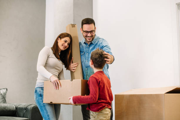 istock Happy parents talking to their son while moving into new home. 1134048167