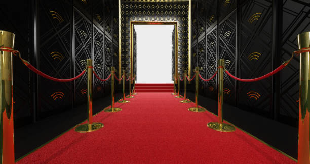 istock 3D rendering of a long red carpet between rope barriers with stair at the end 1134050573