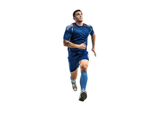 joueur de soccer en uniforme bleu fonctionnant sur l'isolement blanc - athlete soccer player men professional sport photos et images de collection