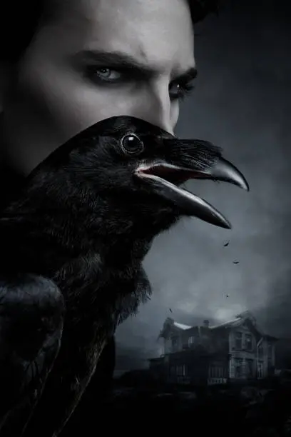 Portrait of vampire and black raven on mistery background