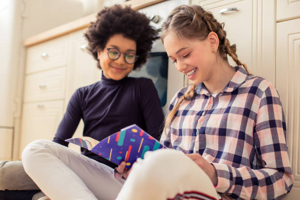 istock Kind longhaired girl looking at her notebook 1134056583