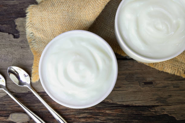istock Yogurt  In white glass wood background. 1134058086