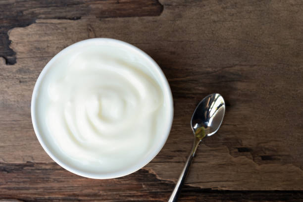 istock Yogurt  In white glass wood background. 1134058177