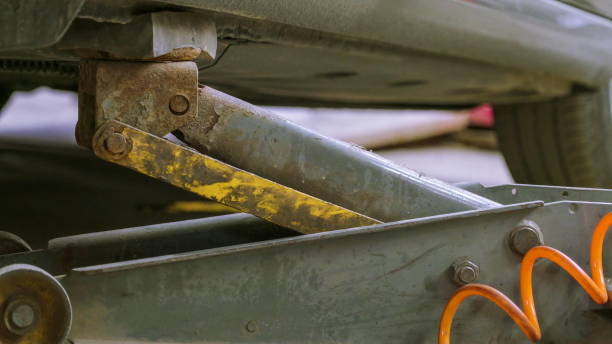 istock The rusty car jack underneath the car in the shop 1134060005