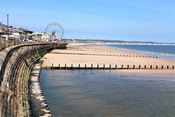 Bridlington, Yorkshire, UK. May 10, 2017.   Tourists and holidaymakers enjoying the promenade and fun fair of the North beach at Bridlington in Yorkshire, UK.