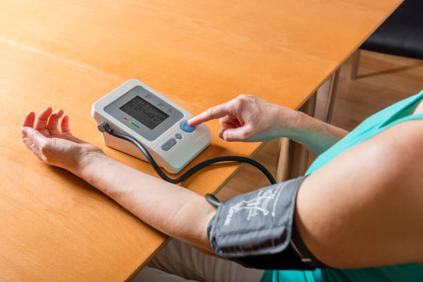 istock woman checking her blood pressure 1134060304
