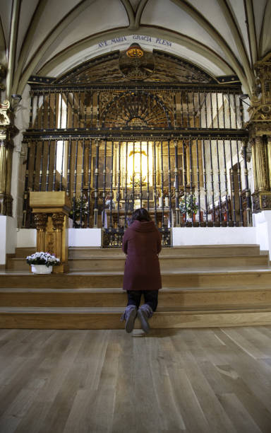 istock Woman praying in church 1134061694