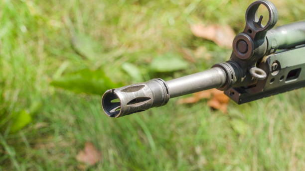 istock The tip front of the sniper on the grassy ground 1134061890