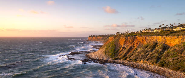 Golden Cove at Sunset on a Windy Day Panorama Long exposure shot of waves crashing into the tall cliffs along the Southern California coast at sunset on a windy day, Golden Cove, Rancho Palos Verdes, California rancho palos verdes stock pictures, royalty-free photos & images