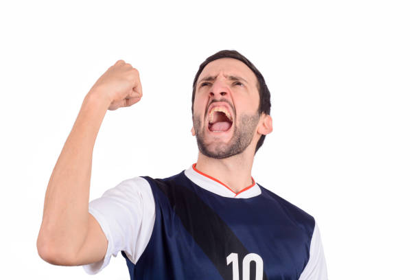 istock Young man in soccer football uniform screaming while his team win. 1134065478