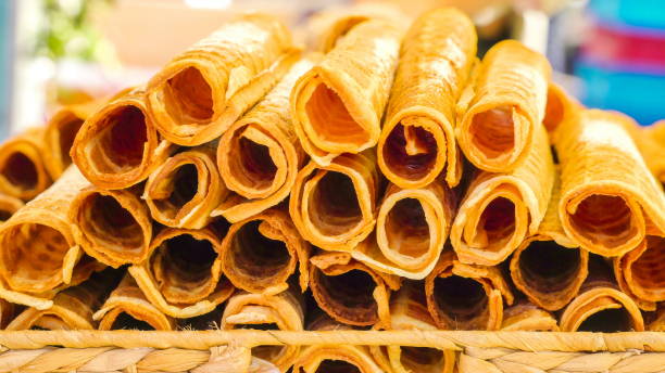 istock The rolled wafer waffles on the table 1134066963