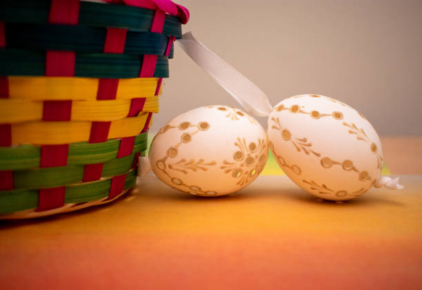 White decorative Easter eggs with basket