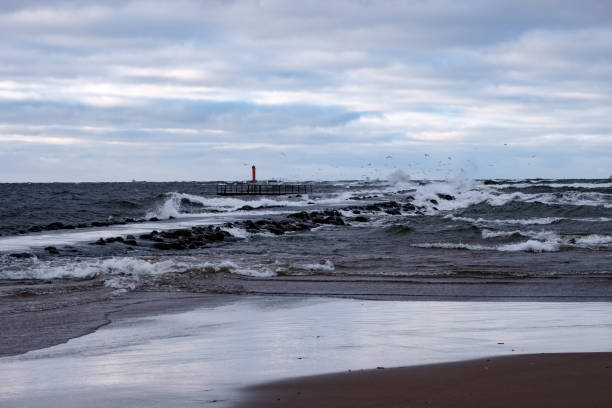 istock moderate storm in baltic sea near lighthouse 1134067130