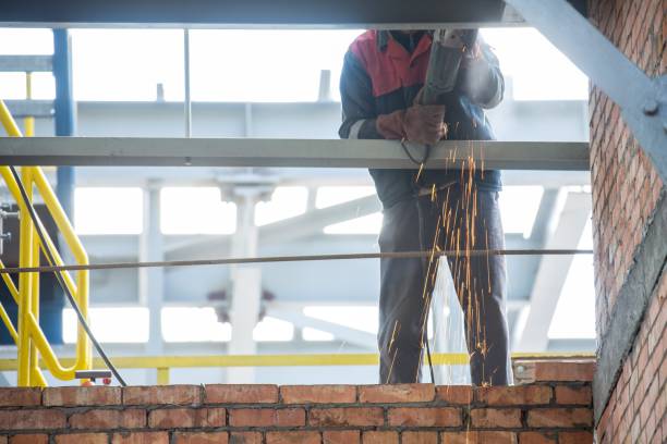 istock factory workers at Koksokhim, welders are engaged in the construction and installation of metal structures on high ground and in special working conditions 1134069148