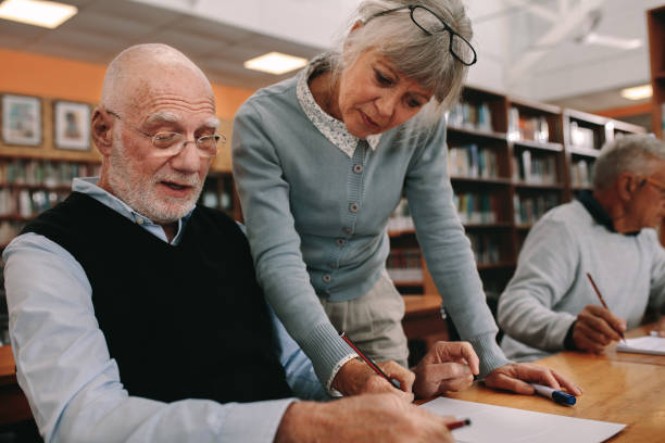 istock Close up of a university professor teaching an elderly man 1134069899