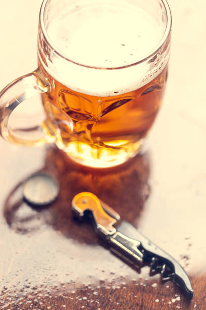 istock Bottle opener and beer on the bar. 1134072258