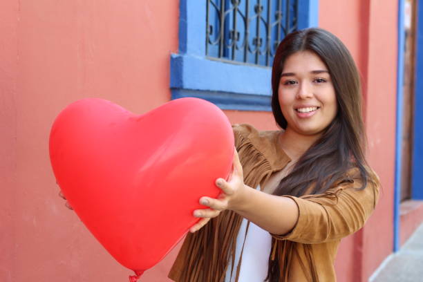 istock Cute girl showing a heart 1134072869