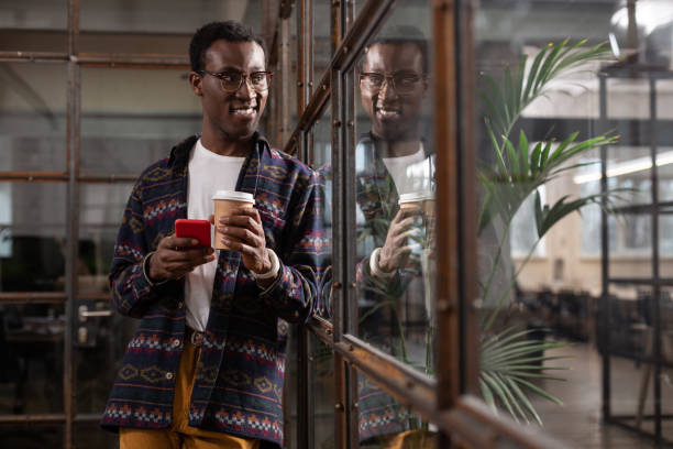 istock Man having a coffee and texting with friends 1134074121