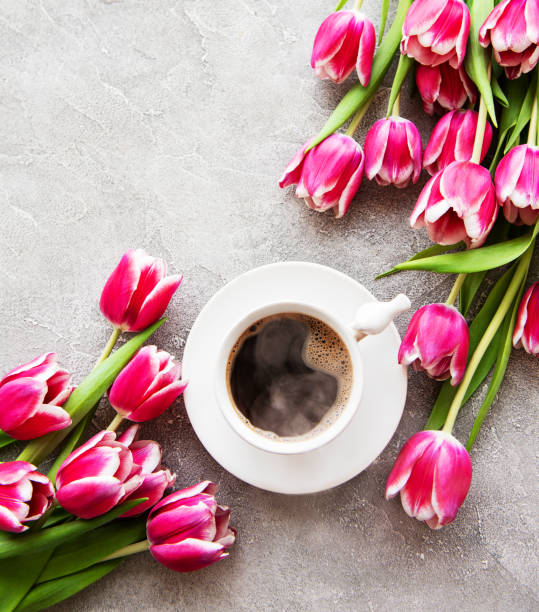 istock Cup of coffee and tulips 1134075381