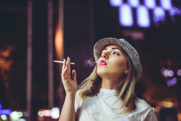 istock Pretty hipster woman with cigarette 1134077113