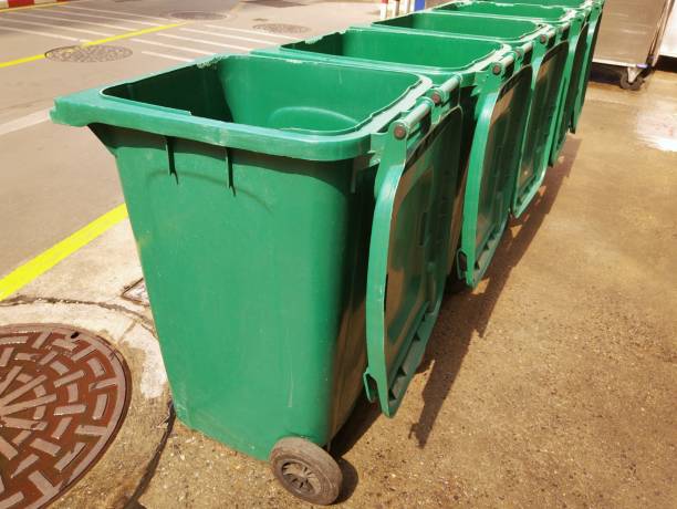 istock Rows of green plastic recycling bin. 1134077339