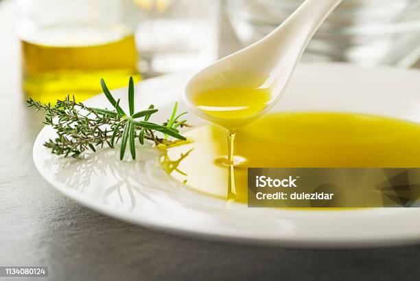 Olive Oil With Herbs Stock Photo - Download Image Now - Olive Oil, Cooking Oil, Olive - Fruit